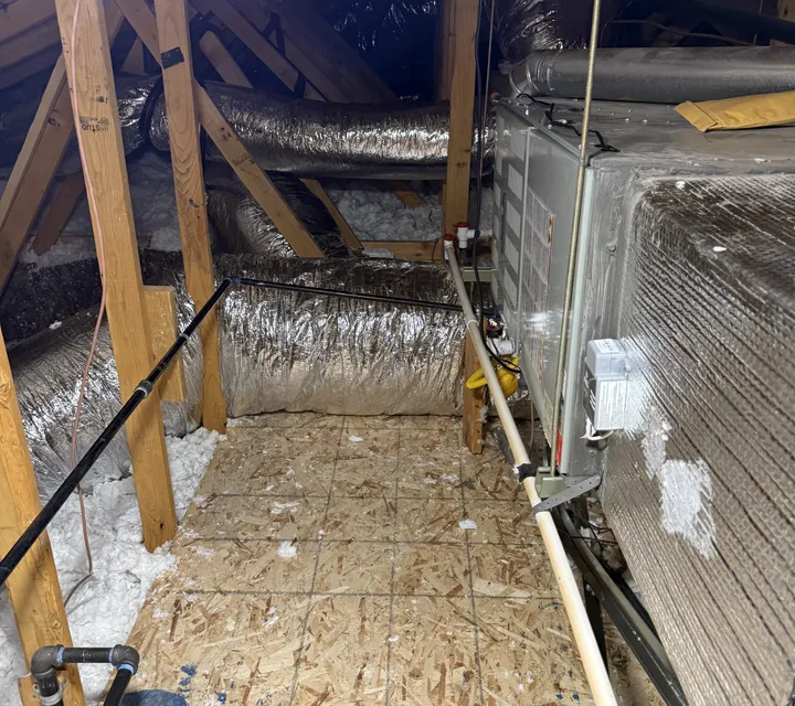 Newly installed furnace and insulated supply ductwork in a Southern Utah attic