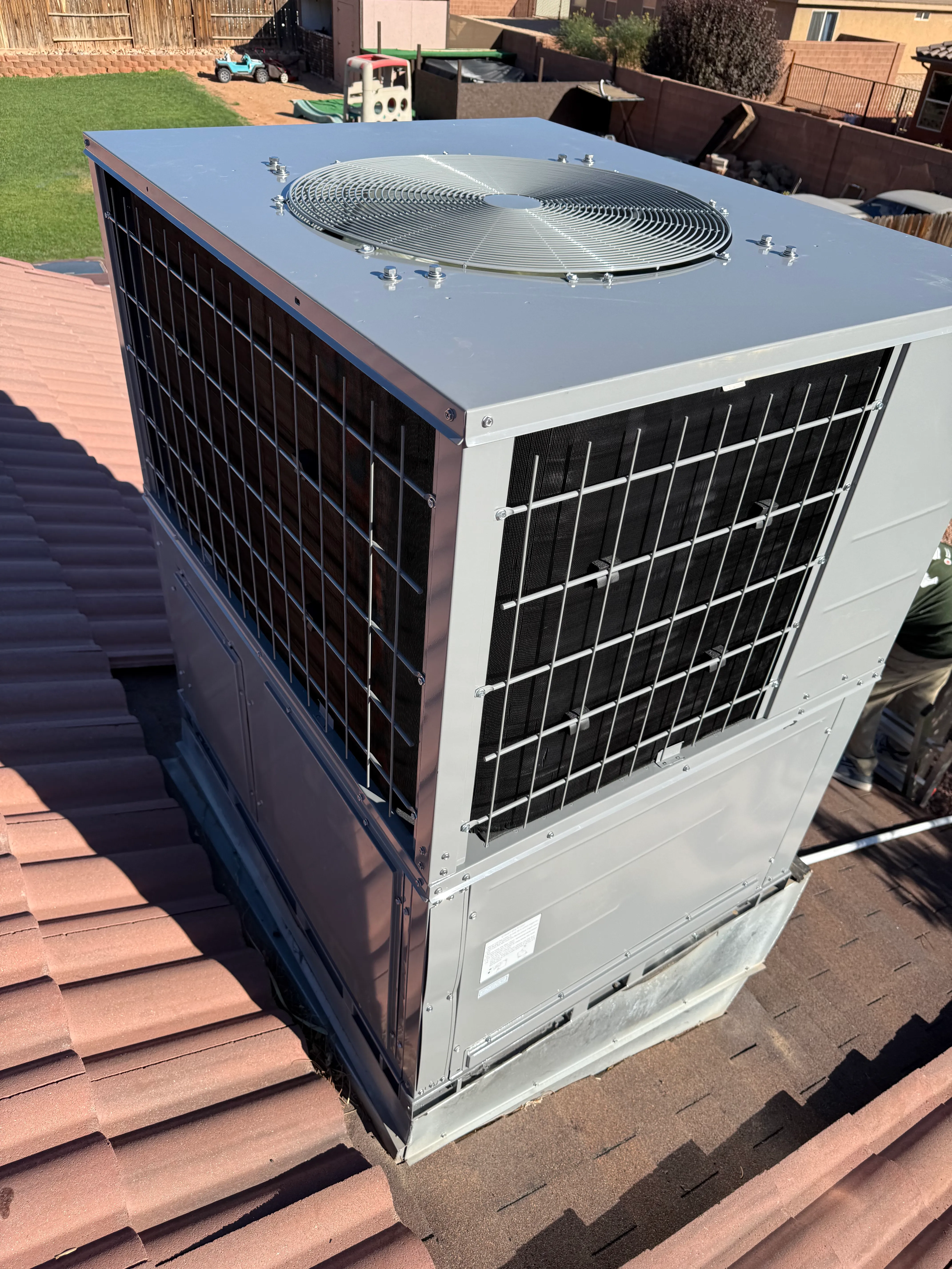 Iron Ridge HVAC technician completing a rooftop install in Southern Utah