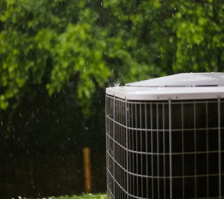 An aging outdoor condenser showing wear, a common reason Southern Utah homeowners choose a full HVAC replacement