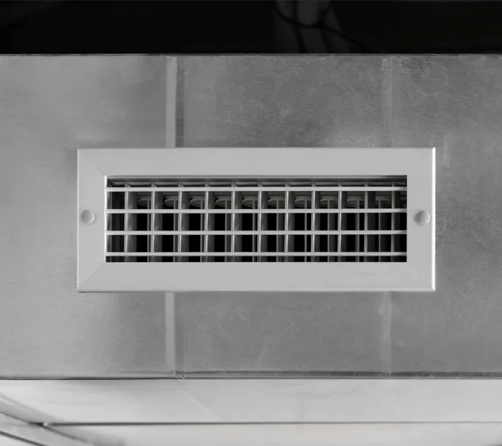 Close-up of a home supply vent that's part of a whole-home filtration and duct-sealing upgrade